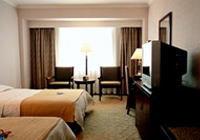 Guest room of the Continental Grand Hotel